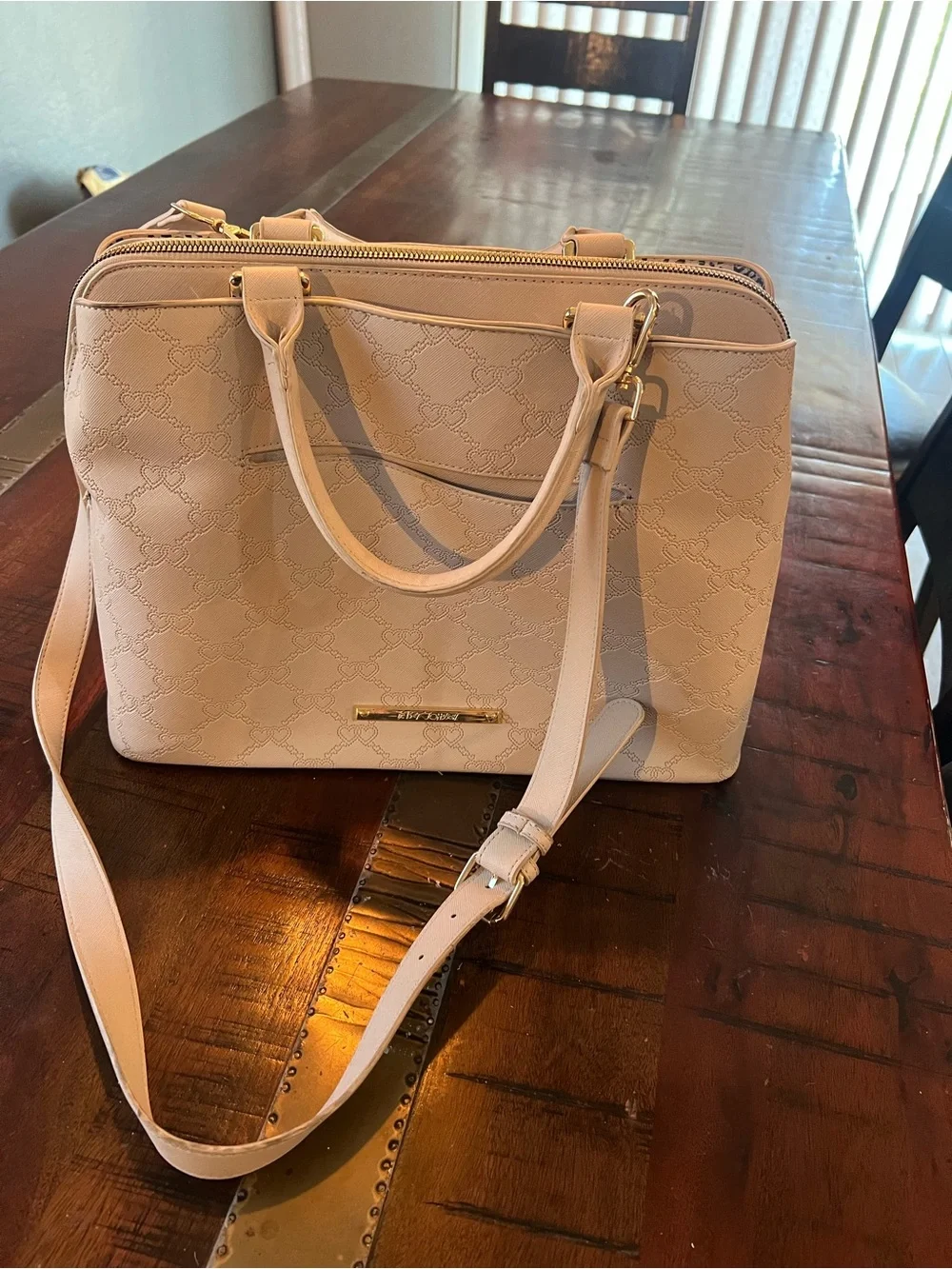 Betsey Johnson satchel handbag featuring an embossed heart pattern